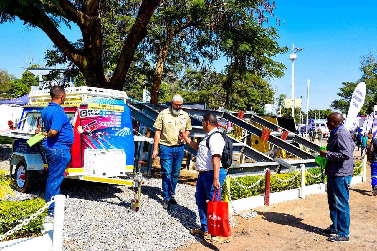 Visitors engaging with exhibitors