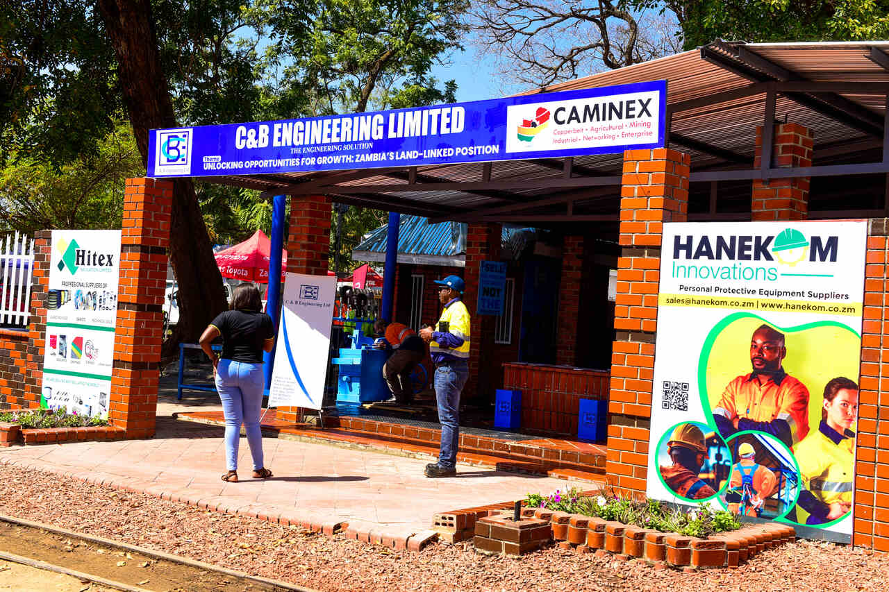 Visitors exploring interactive displays at Caminex