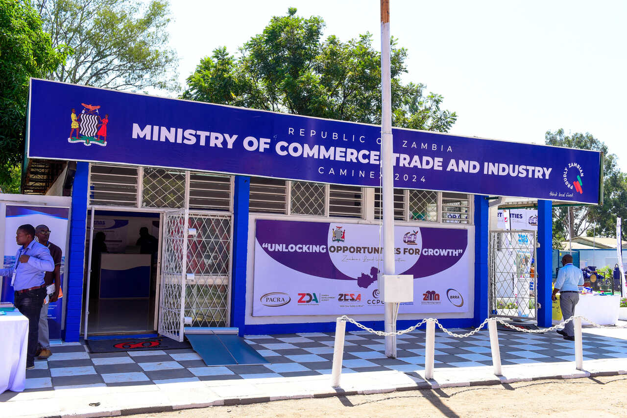 Visitors interacting with exhibitors