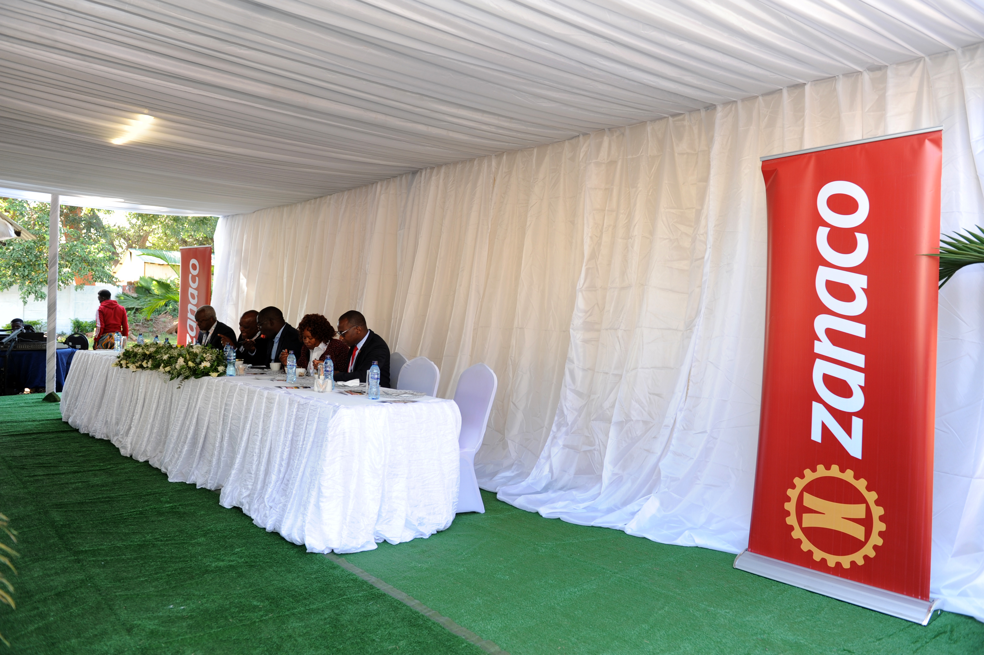 Visitors walking through exhibition